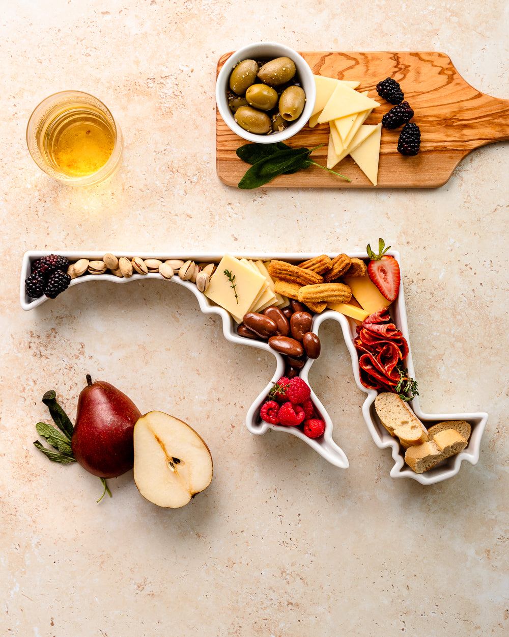 charcuterie board with cheese and cured meats in a Maryland shaped serving tray platter dish