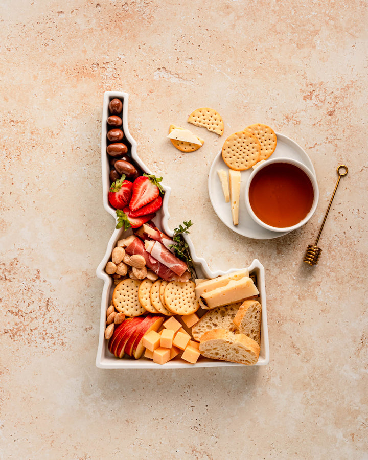 charcuterie board with cheese and cured meats in a Idaho shaped serving tray platter dish