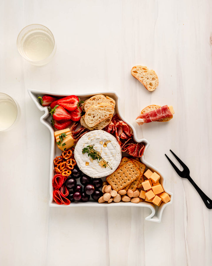 charcuterie board with cheese and cured meats in a Missouri shaped serving tray platter dish