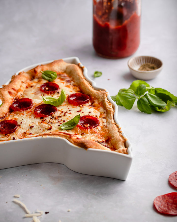 New York style pizza in NY State Plate. New York baking dish. New York pizza dish. New York bakware. NY bakeware. NY pizza tray. NY pizza gift. NY baking gift. NY ceramic gift. State plate shown up close, unique silhouette ceramics.