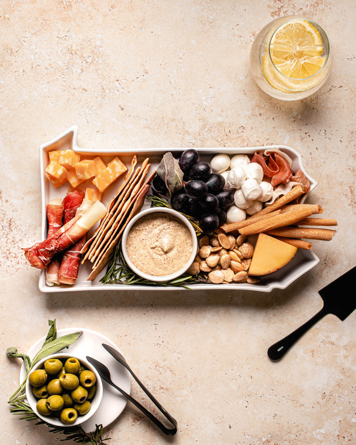 charcuterie board with cheese and cured meats in a Pennsylvania shaped serving tray platter dish