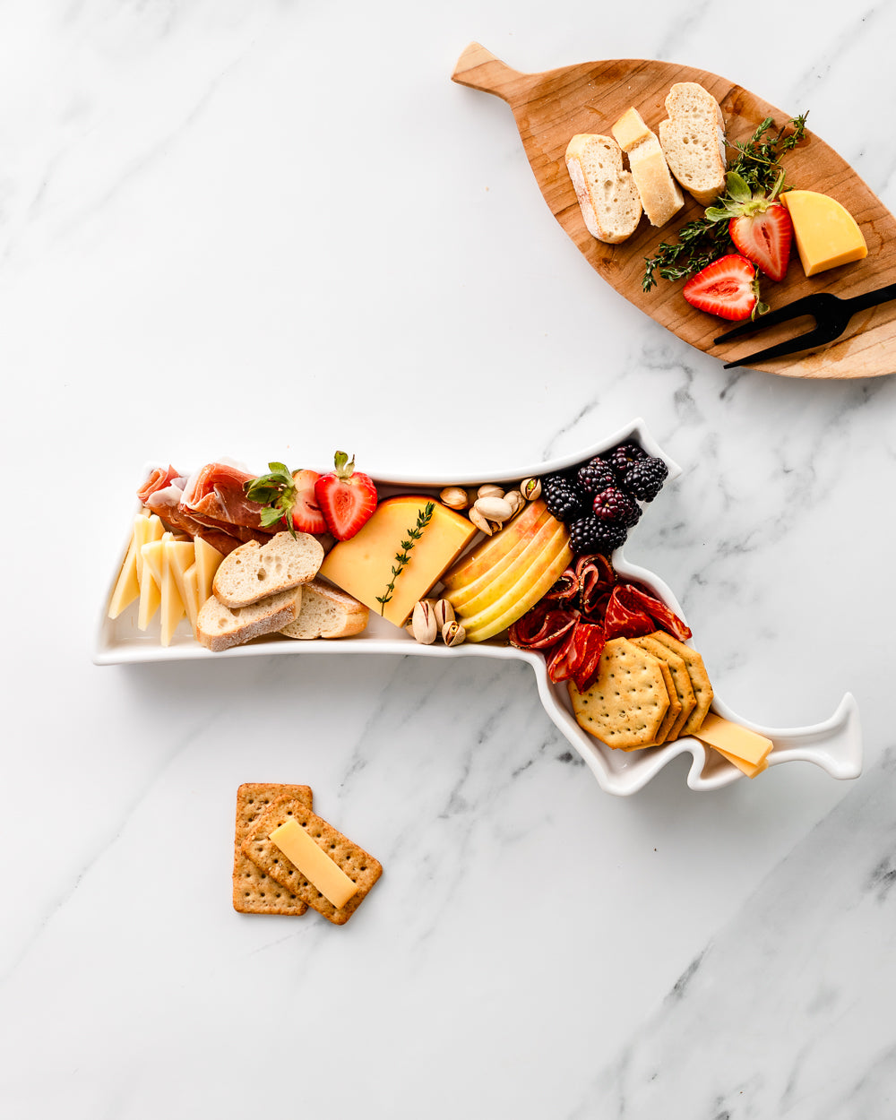 charcuterie board with cheese and cured meats in a Massachusetts shaped serving tray platter dish