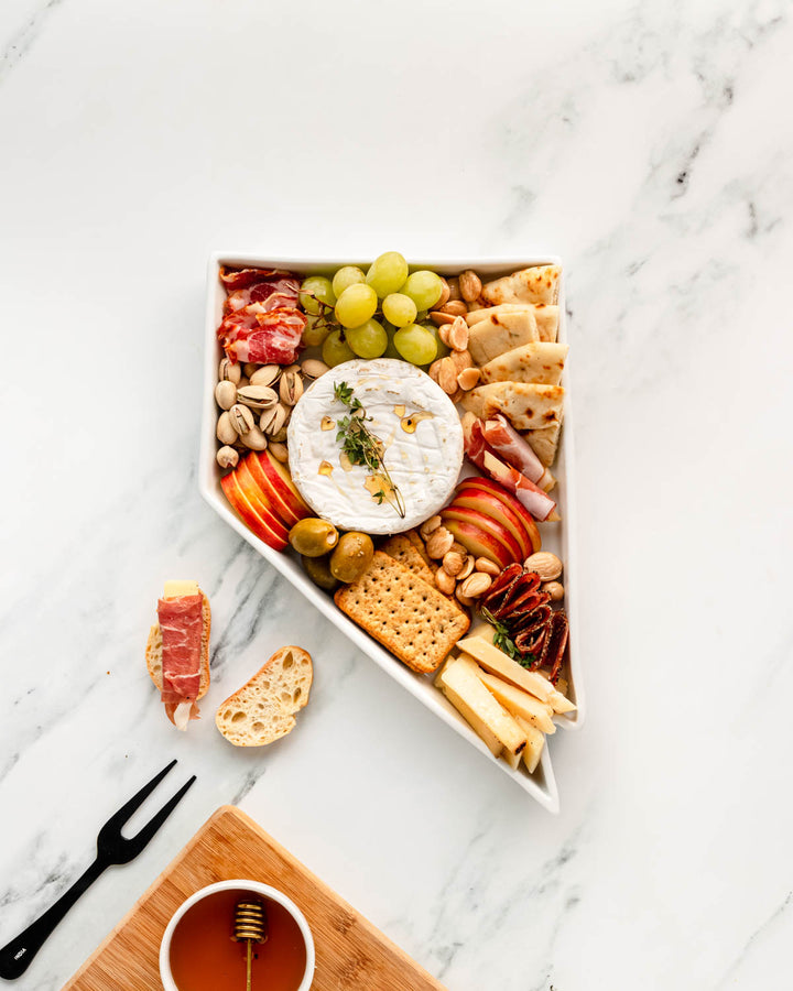charcuterie board with cheese and cured meats in a Nevada shaped serving tray platter dish